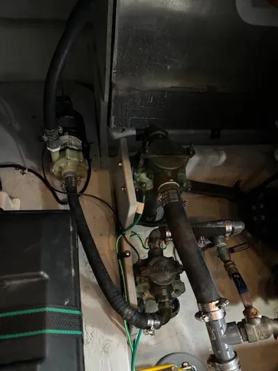  Yacht Photos Pics Engine compartment of 2004 Meridian Sedan Bridge 341 with visible hoses and components.