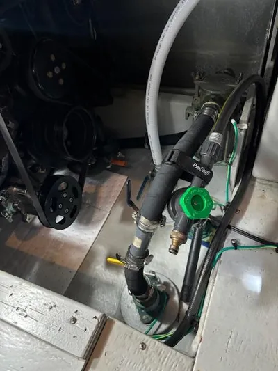  Yacht Photos Pics Engine compartment of 2004 Meridian Sedan Bridge 341 with visible hoses and components.