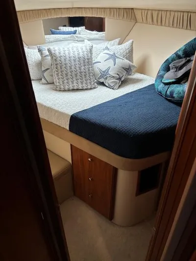  Yacht Photos Pics Cozy bedroom in 2004 Meridian Sedan Bridge 341 yacht with decorative pillows.