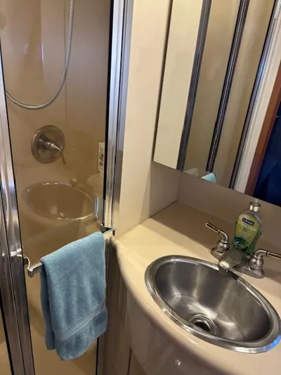  Yacht Photos Pics 2004 Meridian Sedan Bridge 341 bathroom with shower, sink, and towel.