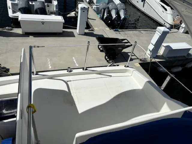  Yacht Photos Pics Meridian Sedan Bridge 341, 2004 model, docked with visible deck and railing.