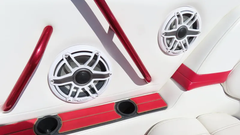  Yacht Photos Pics Interior of 2002 Fountain 47 Lightning boat with speakers and red accents.