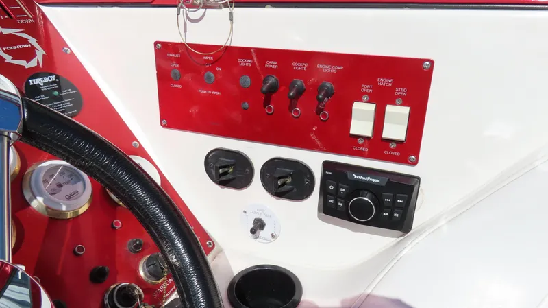  Yacht Photos Pics Control panel of a 2002 Fountain 47 Lightning boat with switches and gauges.