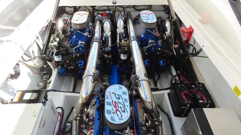  Yacht Photos Pics Engine compartment of a 2002 Fountain 47 Lightning boat, showcasing dual high-performance engines.