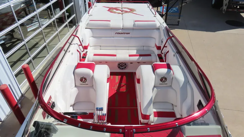  Yacht Photos Pics 2002 Fountain 47 Lightning boat interior with red and white seating and logo detailing.
