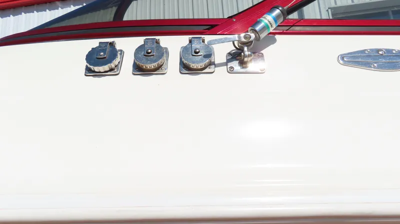  Yacht Photos Pics 2002 Fountain 47 Lightning boat controls and gauges on white panel.