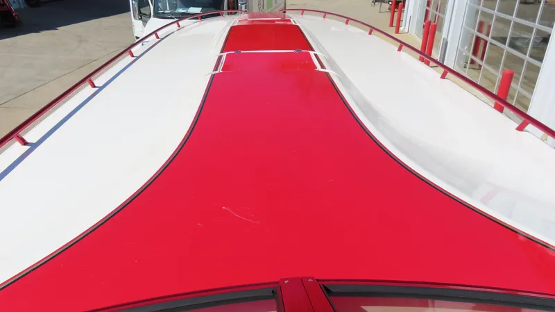  Yacht Photos Pics Top view of a 2002 Fountain 47 Lightning boat with red and white design.