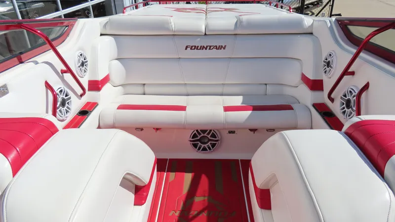  Yacht Photos Pics 2002 Fountain 47 Lightning boat interior with white and red seating, featuring branded upholstery.