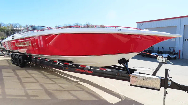  Yacht Photos Pics 2002 Fountain 47 Lightning boat in vibrant red on a trailer.
