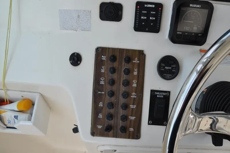  Yacht Photos Pics Control panel of a 2006 Pursuit 345 Drummond Sportfish boat with various switches and gauges.