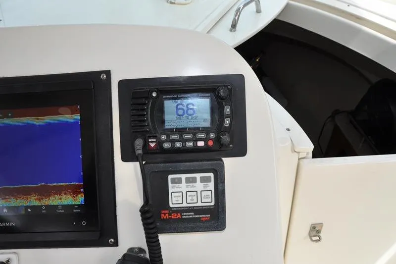  Yacht Photos Pics Control panel of a 2006 Pursuit 345 Drummond Sportfish boat with navigation equipment.