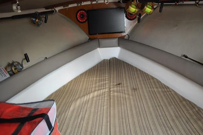  Yacht Photos Pics Interior of a 2006 Pursuit 345 Drummond Sportfish boat with fishing gear.