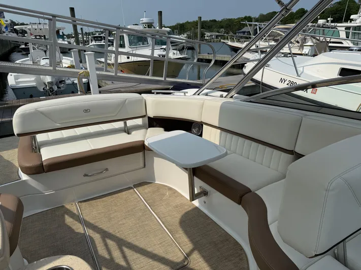  Yacht Photos Pics Luxurious seating area on a 2015 Cobalt 302 boat docked at a marina.