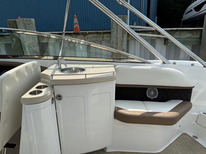  Yacht Photos Pics 2015 Cobalt 302 boat interior with sink and seating area.