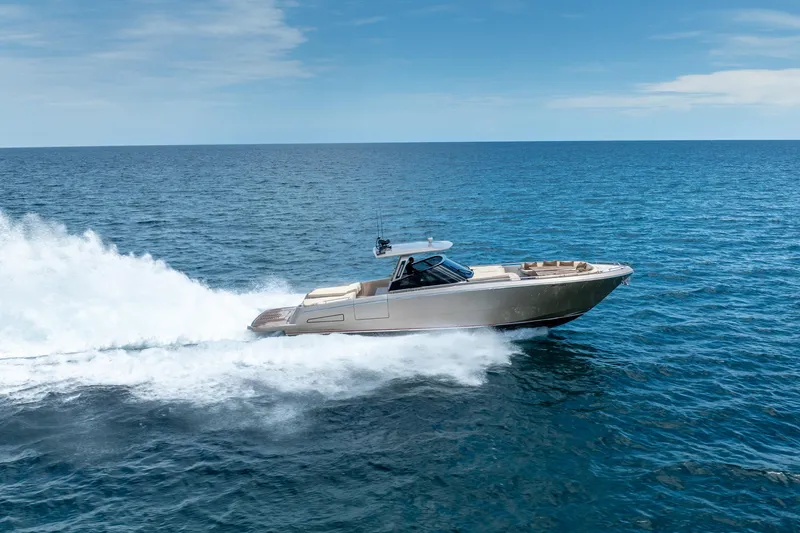 Spin Yacht Photos Pics 2019 CNM Continental 54 yacht cruising on open sea under clear blue sky.