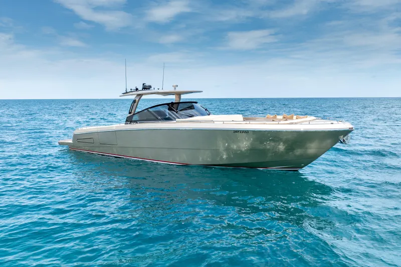 Spin Yacht Photos Pics Luxurious 2019 CNM Continental 54 yacht cruising on clear blue ocean waters.