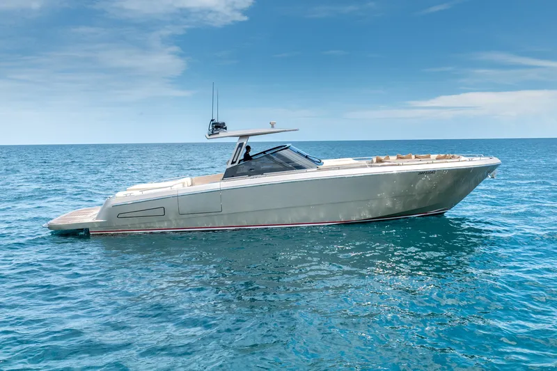 Spin Yacht Photos Pics 2019 CNM Continental 54 yacht cruising on open sea under clear blue sky.