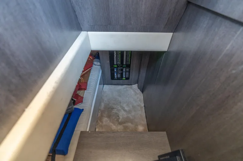 Spin Yacht Photos Pics Interior view of 2019 CNM Continental 54 yacht with control panel and storage area.