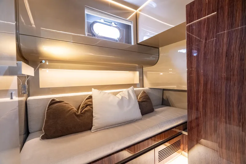 Spin Yacht Photos Pics Luxurious interior of 2019 CNM Continental 54 yacht with elegant seating and cushions.