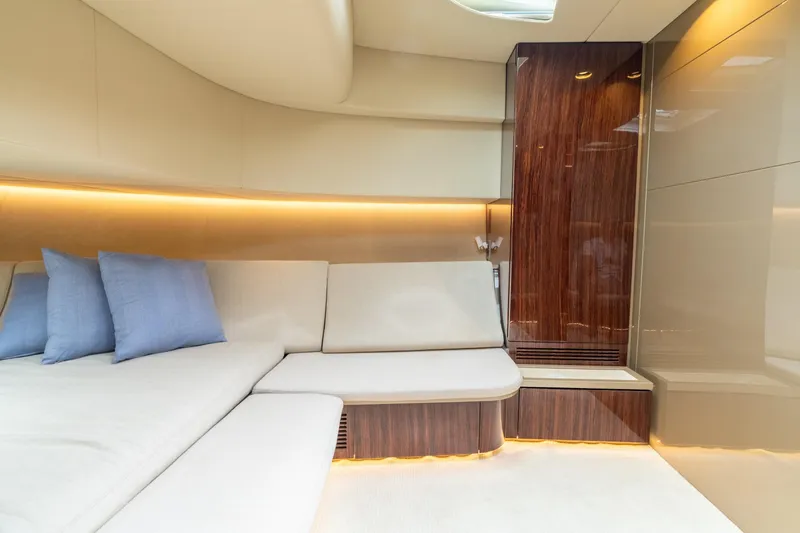 Spin Yacht Photos Pics Luxurious interior of 2019 CNM Continental 54 yacht with elegant seating and ambient lighting.