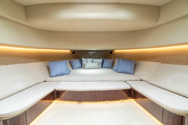 Spin Yacht Photos Pics Luxurious interior of 2019 CNM Continental 54 yacht with elegant seating and ambient lighting.