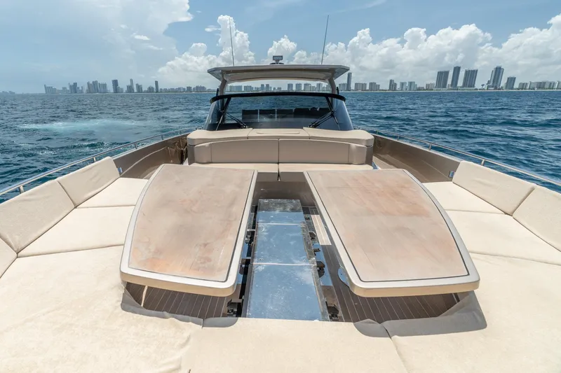 Spin Yacht Photos Pics Luxurious 2019 CNM Continental 54 yacht with spacious deck, ocean view, and city skyline.