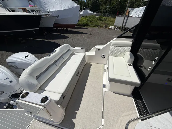  Yacht Photos Pics 2022 Regal 36 XO boat interior with white seating and dual V8 engines.