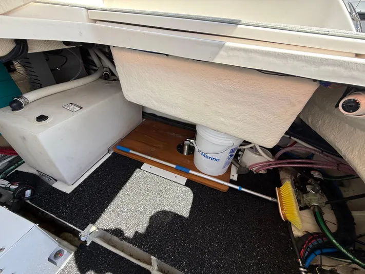  Yacht Photos Pics 2022 Regal 36 XO boat storage area with equipment and cleaning supplies.