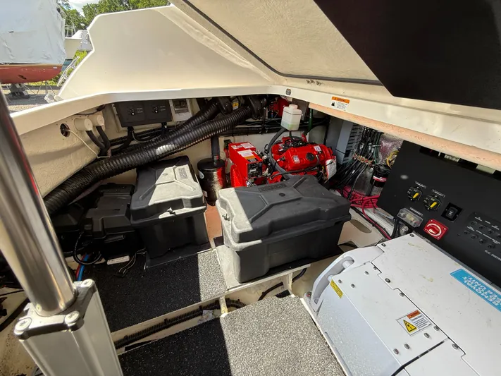  Yacht Photos Pics Engine compartment of a 2022 Regal 36 XO boat, showcasing batteries and wiring.
