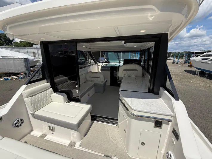  Yacht Photos Pics 2022 Regal 36 XO yacht interior with luxurious seating and modern design.