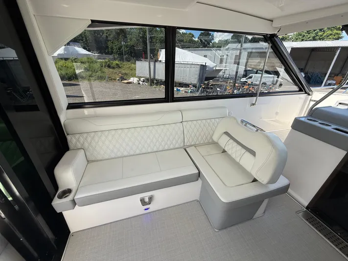  Yacht Photos Pics Interior of 2022 Regal 36 XO yacht with white leather seating.