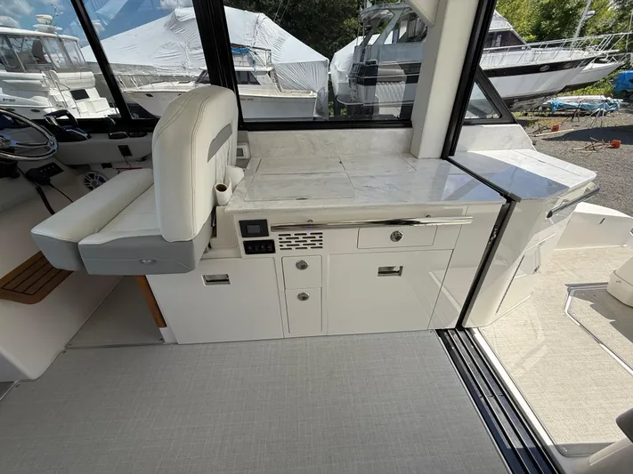  Yacht Photos Pics Interior of 2022 Regal 36 XO yacht with modern seating and sleek cabinetry.