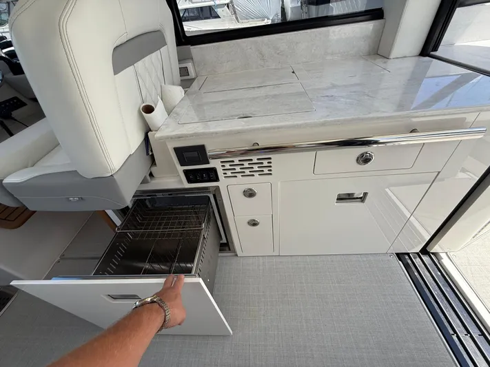  Yacht Photos Pics 2022 Regal 36 XO yacht interior with open drawer and modern cabinetry.