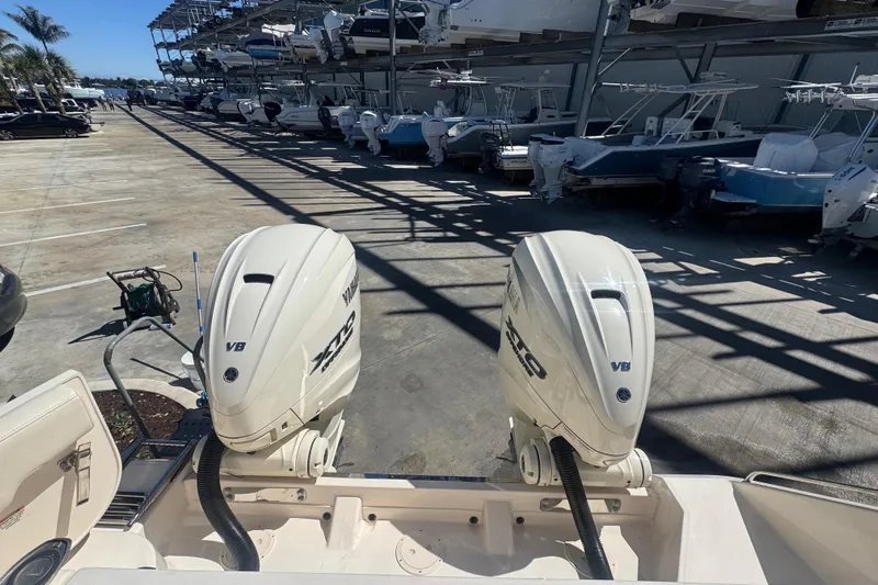 Your New Boat! Yacht Photos Pics 2024 Grady-White Canyon 336 with dual Yamaha V8 outboard engines in a marina.