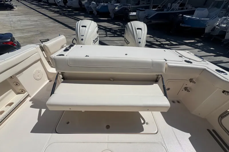 Your New Boat! Yacht Photos Pics 2024 Grady-White Canyon 336 boat interior with foldable seating and dual outboard engines.