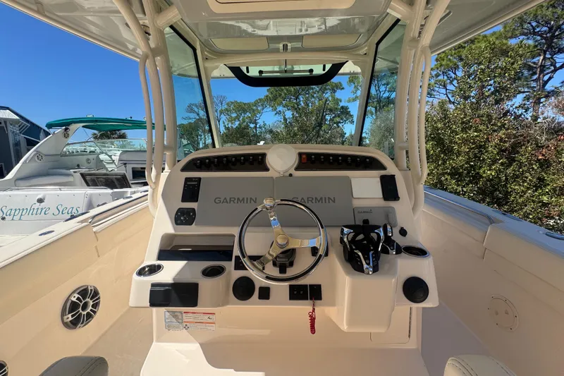 Your New Boat! Yacht Photos Pics 2024 Grady-White Canyon 336 helm with Garmin navigation, sleek design, and modern controls.