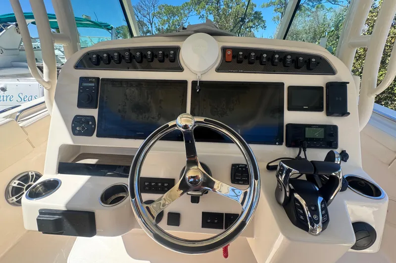 Your New Boat! Yacht Photos Pics 2024 Grady-White Canyon 336 helm with advanced navigation and control systems.
