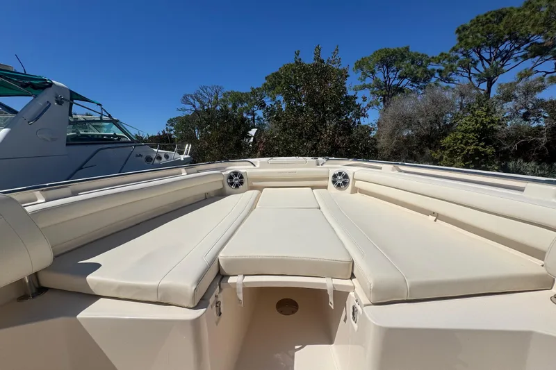 Your New Boat! Yacht Photos Pics 2024 Grady-White Canyon 336 boat interior with beige seating and speakers.