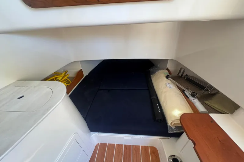 Your New Boat! Yacht Photos Pics 2024 Grady-White Canyon 336 cabin interior with storage and seating area.