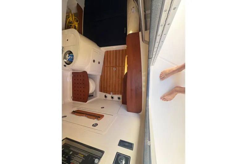 Your New Boat! Yacht Photos Pics 2024 Grady-White Canyon 336 boat interior with teak flooring and control panel.