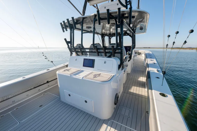  Yacht Photos Pics 2022 Freeman 42 LR boat with sleek deck design and advanced fishing equipment.