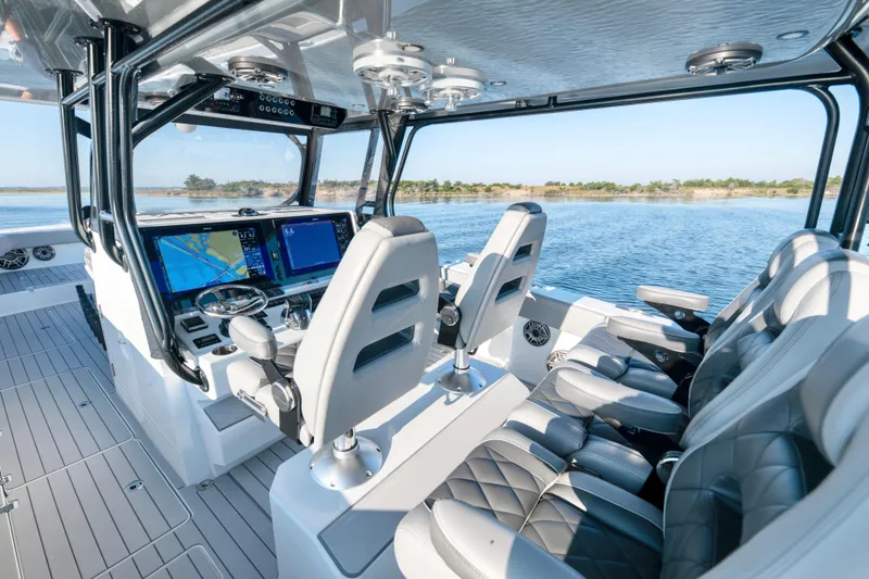  Yacht Photos Pics Interior of 2022 Freeman 42 LR boat with advanced navigation system and luxurious seating.