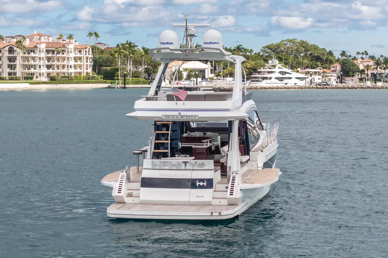 Infinity Yacht Photos Pics 2020 Galeon 500 Fly yacht cruising near luxury waterfront homes.