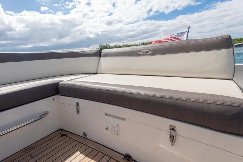 Infinity Yacht Photos Pics Luxury seating on 2020 Galeon 500 Fly yacht with American flag in background.