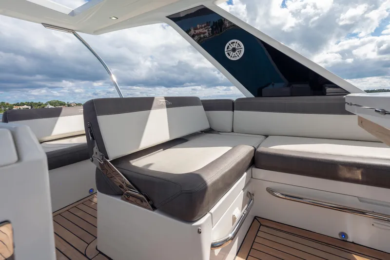 Infinity Yacht Photos Pics Luxurious seating area on 2020 Galeon 500 Fly yacht under a partly cloudy sky.