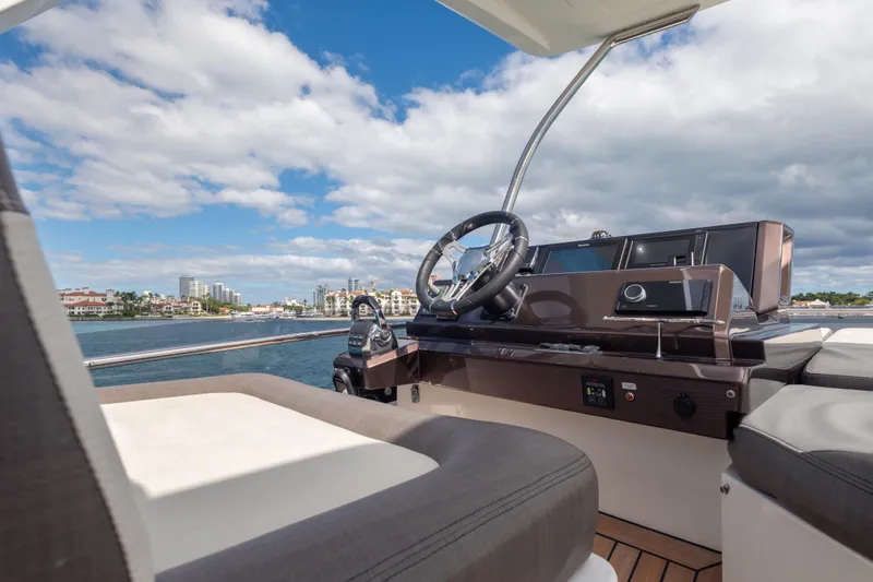 Infinity Yacht Photos Pics 2020 Galeon 500 Fly yacht helm with scenic waterfront view.