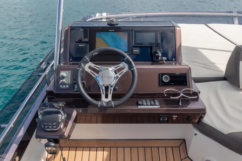Infinity Yacht Photos Pics Helm of 2020 Galeon 500 Fly yacht with modern navigation equipment and steering wheel.