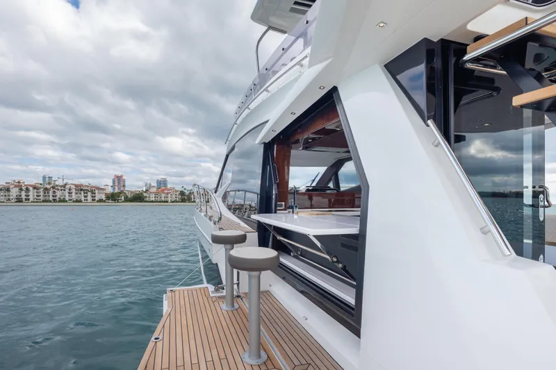 Infinity Yacht Photos Pics 2020 Galeon 500 Fly yacht with sleek design and waterfront view.