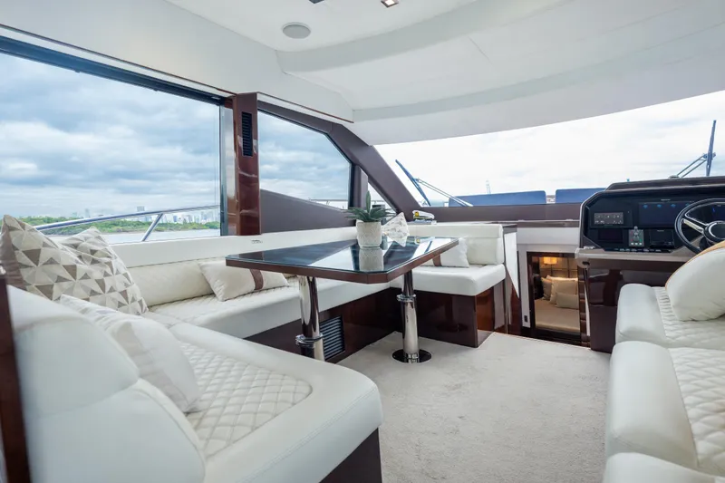 Infinity Yacht Photos Pics Luxurious interior of 2020 Galeon 500 Fly yacht with elegant seating and panoramic windows.