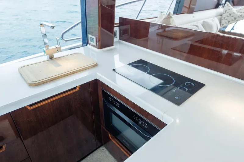 Infinity Yacht Photos Pics Modern kitchen on 2020 Galeon 500 Fly yacht with sleek appliances and ocean view.